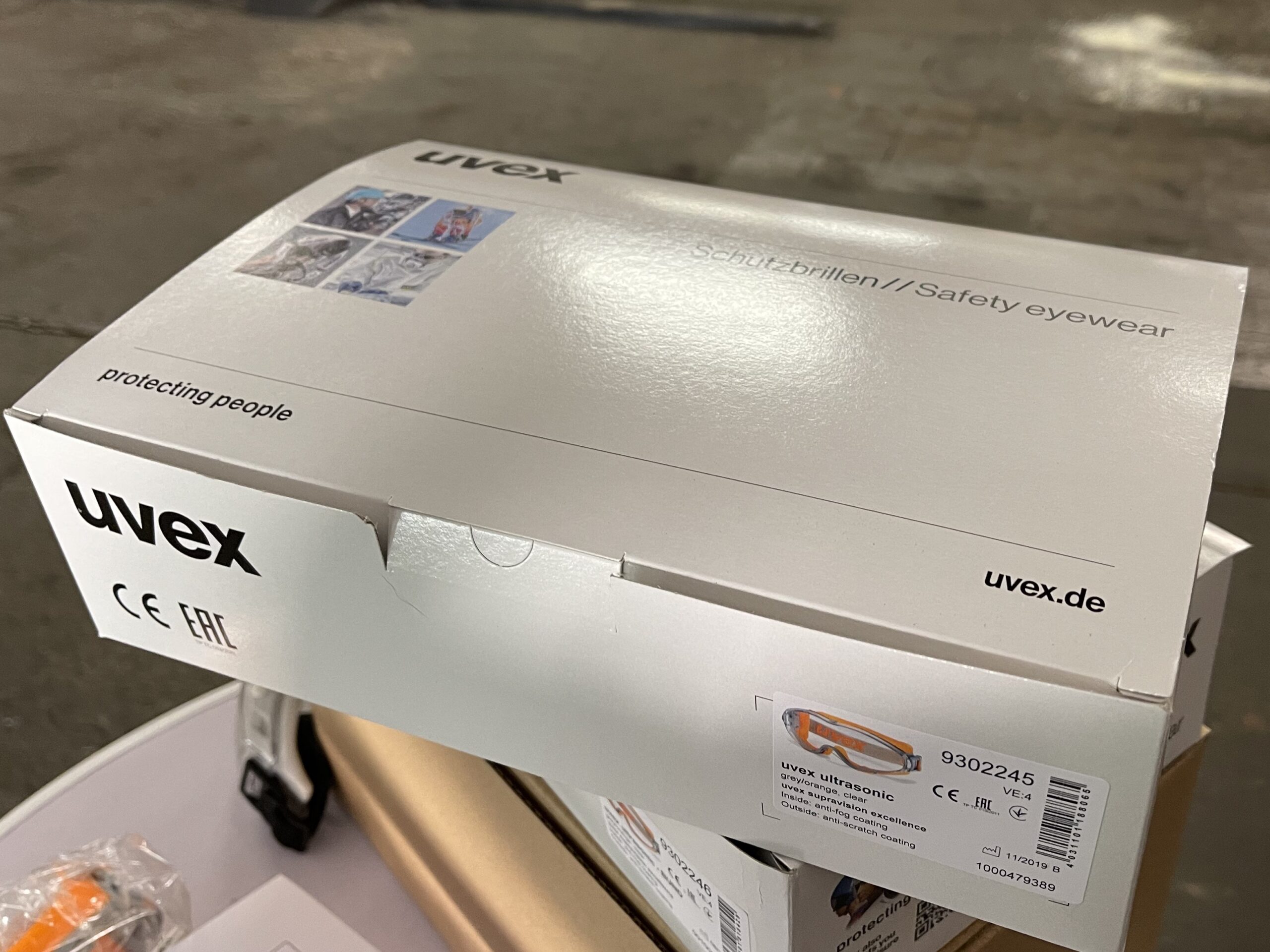 UVEX Schutzbrille ultrasonic grey orange, clear, supravision excellence